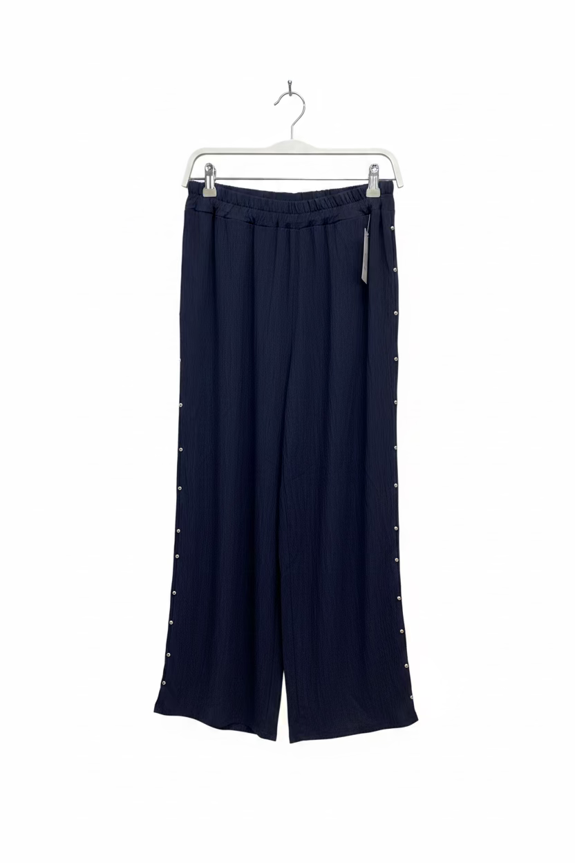 Pantalón de tachuelas