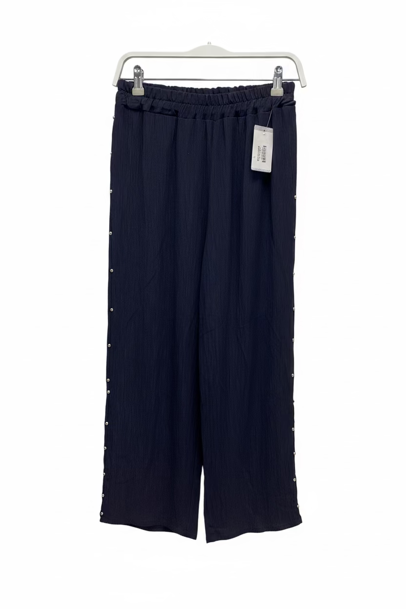 Pantalón con tachuelas